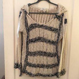 Long sleeved loosely knit sweater